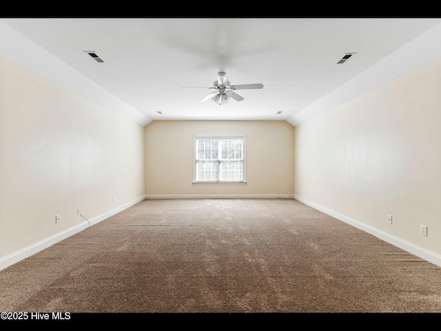 822 Lambrook Dr, Wilmington, NC 28411 - empty room featuring lofted ceiling, light carpet, a ceiling fan, and baseboards
