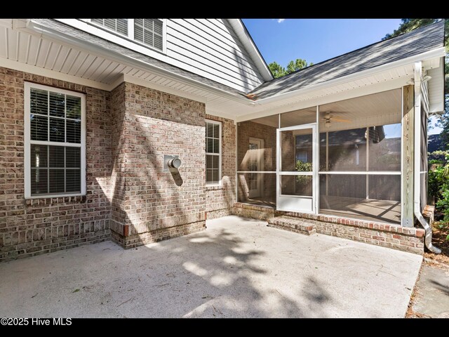 822 Lambrook Dr, Wilmington, NC 28411 - view of patio with a sunroom