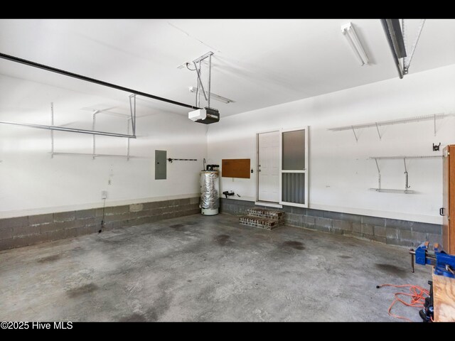 822 Lambrook Dr, Wilmington, NC 28411 - garage featuring electric panel, gas water heater, a garage door opener, and concrete block wall