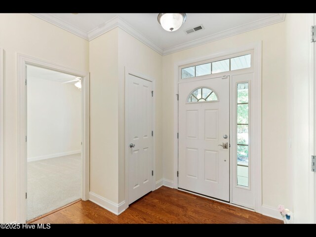822 Lambrook Dr, Wilmington, NC 28411 - foyer with wood finished floors, ornamental molding, and baseboards