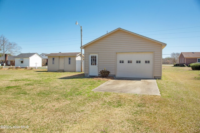 3007 Camelot Dr, Kinston, NC 28504 - view of front of property with an outdoor structure, a detached garage, and a front yard