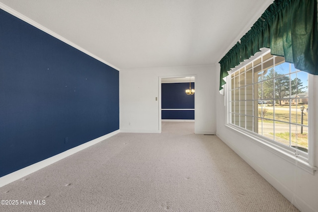 3007 Camelot Dr, Kinston, NC 28504 - carpeted spare room featuring baseboards, a chandelier, and ornamental molding