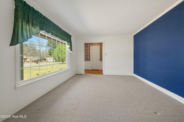 3007 Camelot Dr, Kinston, NC 28504 - unfurnished room featuring plenty of natural light, carpet, baseboards, and crown molding