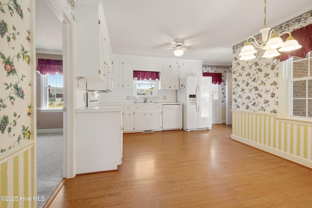 3007 Camelot Dr, Kinston, NC 28504 - kitchen featuring white appliances, wallpapered walls, light wood-style flooring, light countertops, and ceiling fan