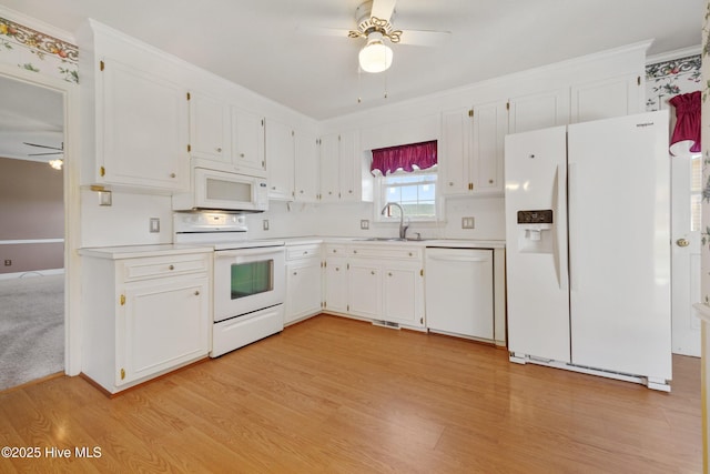 3007 Camelot Dr, Kinston, NC 28504 - kitchen featuring white appliances, ceiling fan, a sink, light countertops, and ornamental molding