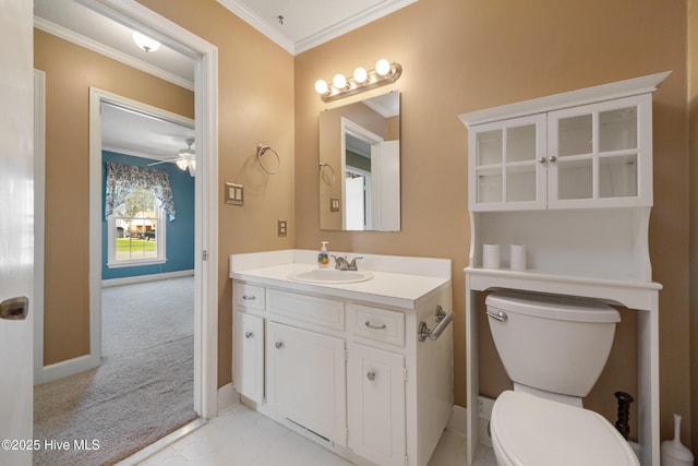 3007 Camelot Dr, Kinston, NC 28504 - bathroom with vanity, crown molding, toilet, baseboards, and a ceiling fan