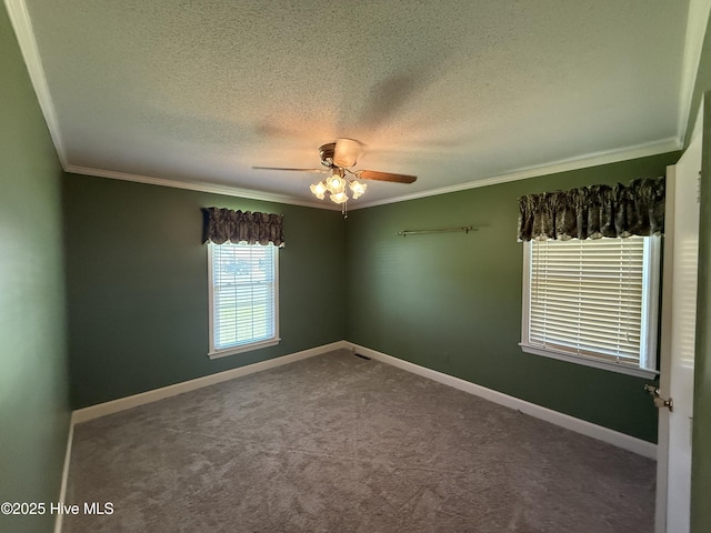 3007 Camelot Dr, Kinston, NC 28504 - carpeted spare room with ornamental molding, a ceiling fan, a textured ceiling, and baseboards