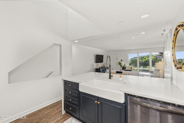 2106 E Fort Macon Rd Unit 310Tar, Atlantic Beach, NC 28512 - kitchen with dishwasher, a sink, light wood-style floors, open floor plan, and light countertops
