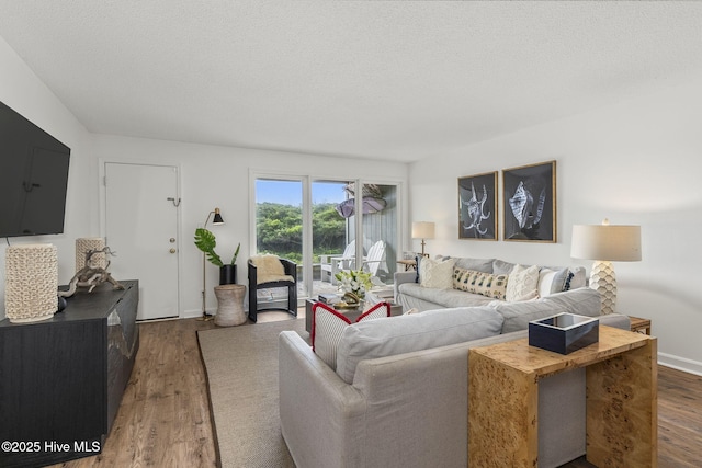 2106 E Fort Macon Rd Unit 310Tar, Atlantic Beach, NC 28512 - living area featuring wood finished floors and a textured ceiling