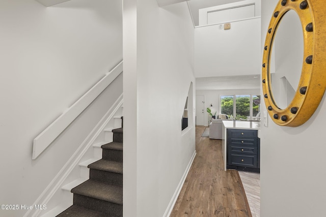 2106 E Fort Macon Rd Unit 310Tar, Atlantic Beach, NC 28512 - stairway featuring wood finished floors and baseboards