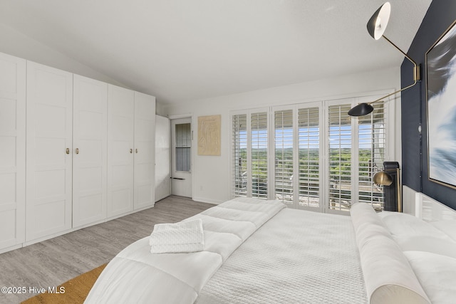 2106 E Fort Macon Rd Unit 310Tar, Atlantic Beach, NC 28512 - bedroom featuring light wood finished floors and lofted ceiling