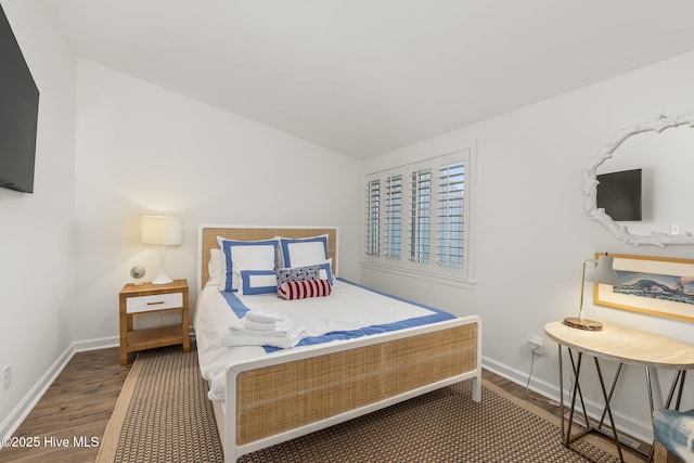 2106 E Fort Macon Rd Unit 310Tar, Atlantic Beach, NC 28512 - bedroom featuring wood finished floors, baseboards, and lofted ceiling