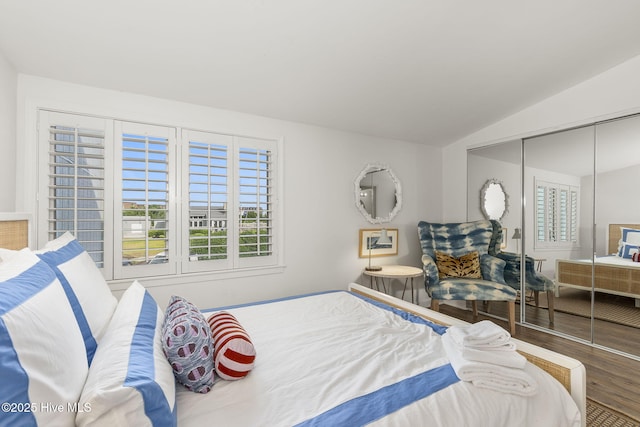 2106 E Fort Macon Rd Unit 310Tar, Atlantic Beach, NC 28512 - bedroom with wood finished floors, vaulted ceiling, and a closet