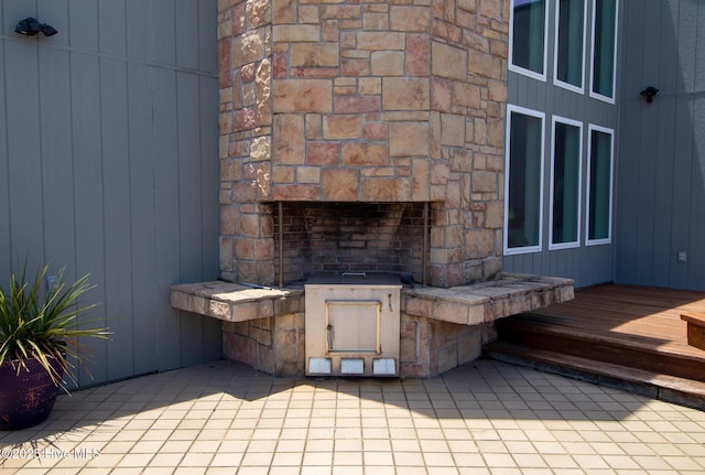 2106 E Fort Macon Rd Unit 310Tar, Atlantic Beach, NC 28512 - view of patio featuring a stone fireplace and a wooden deck