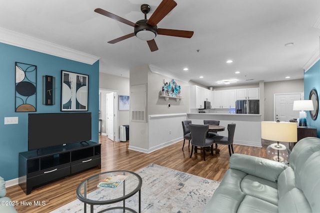 395 S Crow Creek Dr Unit 1511, Calabash, NC 28467 - living area with ceiling fan, wood finished floors, baseboards, crown molding, and recessed lighting