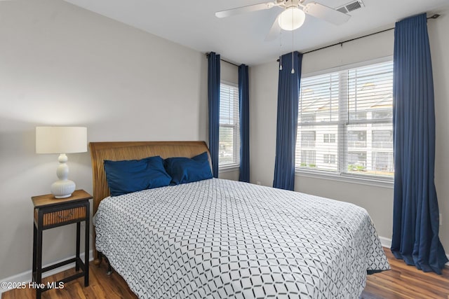 395 S Crow Creek Dr Unit 1511, Calabash, NC 28467 - bedroom with wood finished floors and a ceiling fan