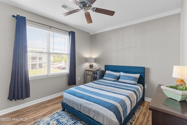 395 S Crow Creek Dr Unit 1511, Calabash, NC 28467 - bedroom with wood finished floors, baseboards, ornamental molding, and a ceiling fan