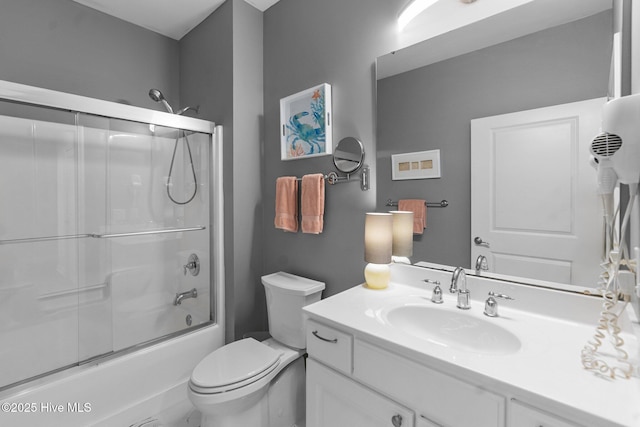 395 S Crow Creek Dr Unit 1511, Calabash, NC 28467 - bathroom featuring vanity, toilet, and bath / shower combo with glass door