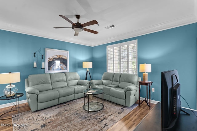 395 S Crow Creek Dr Unit 1511, Calabash, NC 28467 - living area featuring ceiling fan, crown molding, wood finished floors, and baseboards