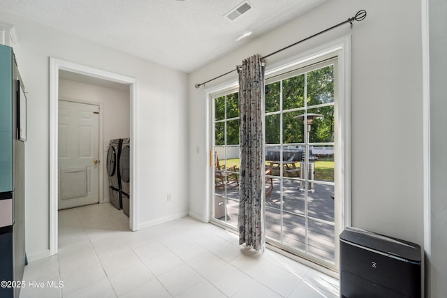218 Yearling Loop, Jacksonville, NC 28540 - entryway with baseboards, washer and clothes dryer, and light tile patterned flooring