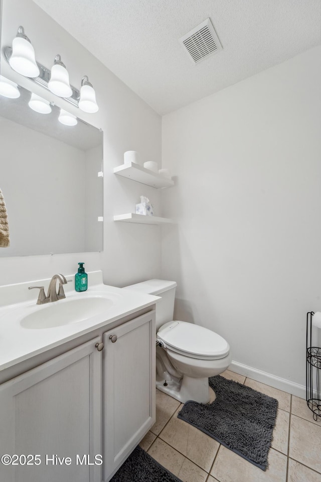 218 Yearling Loop, Jacksonville, NC 28540 - bathroom with vanity, tile patterned flooring, toilet, and a textured ceiling