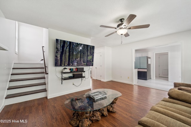 218 Yearling Loop, Jacksonville, NC 28540 - living area with ceiling fan, stairway, wood finished floors, and baseboards