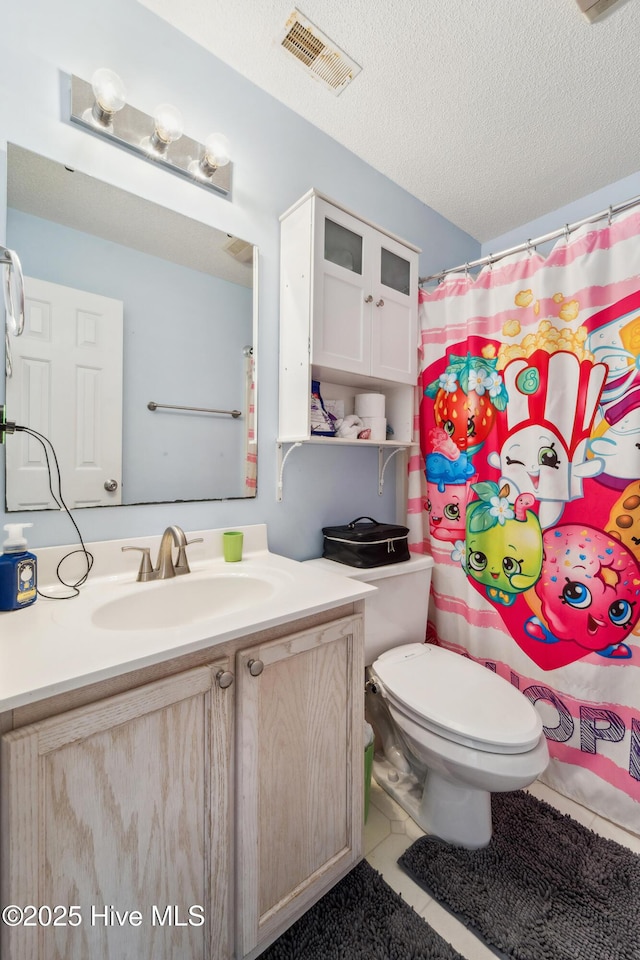 218 Yearling Loop, Jacksonville, NC 28540 - full bath featuring vanity, tile patterned floors, toilet, a shower with shower curtain, and a textured ceiling
