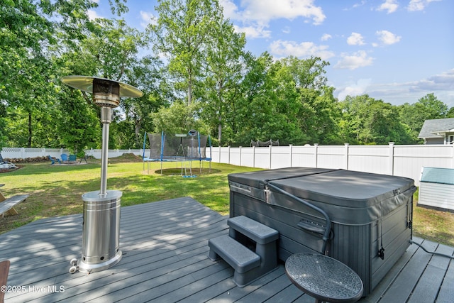 218 Yearling Loop, Jacksonville, NC 28540 - wooden deck featuring a hot tub and a trampoline
