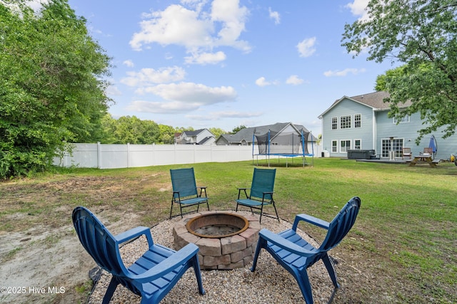 218 Yearling Loop, Jacksonville, NC 28540 - view of yard with a fire pit and a trampoline