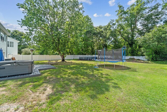 218 Yearling Loop, Jacksonville, NC 28540 - view of yard featuring a trampoline and a hot tub