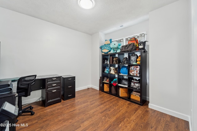218 Yearling Loop, Jacksonville, NC 28540 - office space with dark wood-type flooring, baseboards, and a textured ceiling