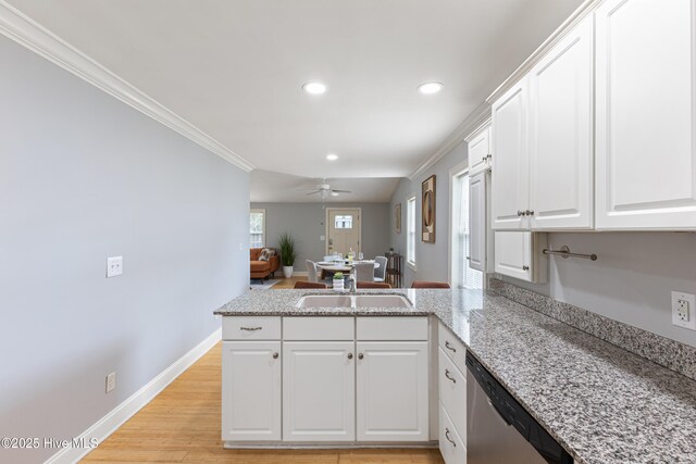 2415 Circle St, Wilmington, NC 28403 - kitchen with a sink, dishwasher, crown molding, a peninsula, and recessed lighting