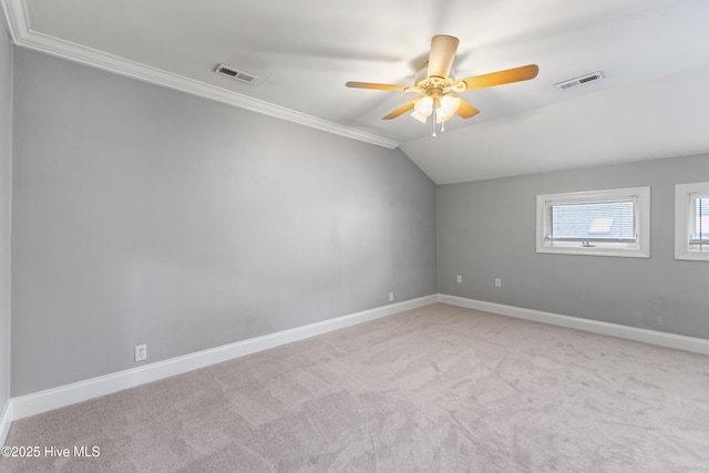 2415 Circle St, Wilmington, NC 28403 - empty room with vaulted ceiling, a ceiling fan, carpet, baseboards, and crown molding