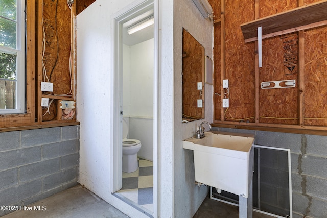 2415 Circle St, Wilmington, NC 28403 - bathroom with toilet, concrete flooring, and a sink
