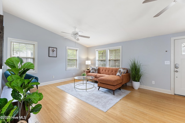 2415 Circle St, Wilmington, NC 28403 - living room featuring a ceiling fan, vaulted ceiling, light wood-style flooring, and baseboards