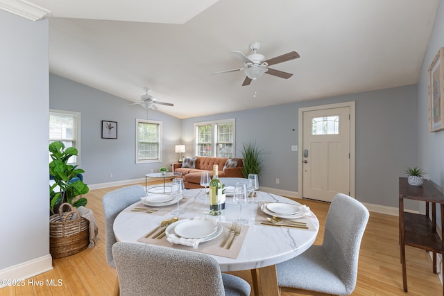 2415 Circle St, Wilmington, NC 28403 - dining area featuring light wood-style floors, a ceiling fan, baseboards, and lofted ceiling