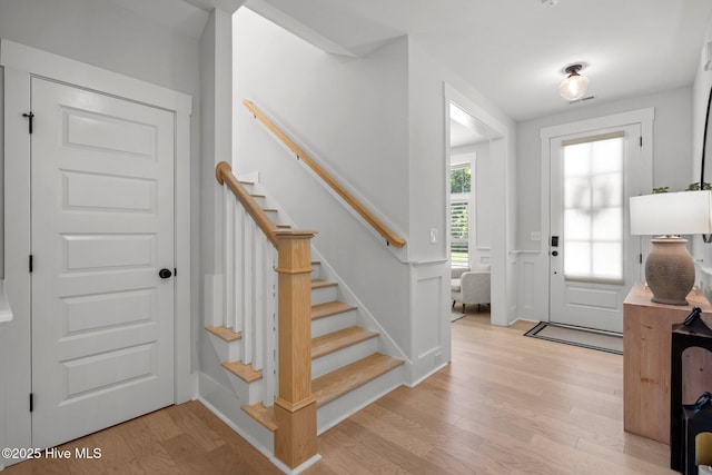 3625 Mason Port Dr, Wilmington, NC 28409 - foyer entrance featuring light wood-style floors, stairway, and baseboards