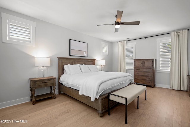3625 Mason Port Dr, Wilmington, NC 28409 - bedroom featuring light wood-type flooring, baseboards, multiple windows, and ceiling fan