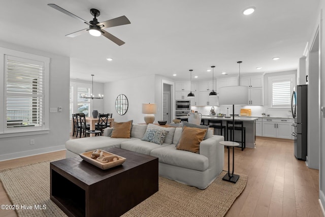 3625 Mason Port Dr, Wilmington, NC 28409 - living area featuring recessed lighting, healthy amount of natural light, light wood-type flooring, and a ceiling fan