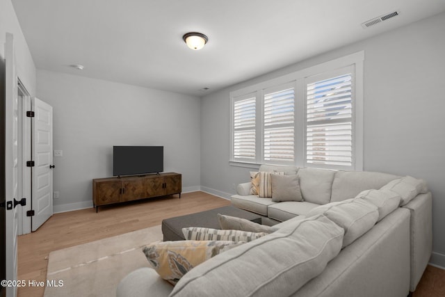 3625 Mason Port Dr, Wilmington, NC 28409 - living room featuring light wood-style floors and baseboards