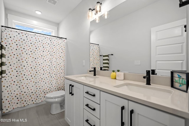 3625 Mason Port Dr, Wilmington, NC 28409 - full bathroom featuring toilet, double vanity, a shower with shower curtain, and tile patterned floors