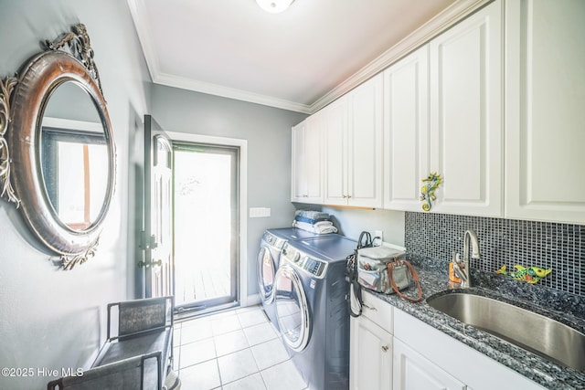 6428 Salem Ridge Dr, Grifton, NC 28530 - washroom featuring cabinet space, washing machine and dryer, light tile patterned flooring, ornamental molding, and baseboards