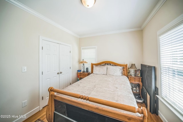 6428 Salem Ridge Dr, Grifton, NC 28530 - bedroom with wood finished floors, ornamental molding, baseboards, and a closet