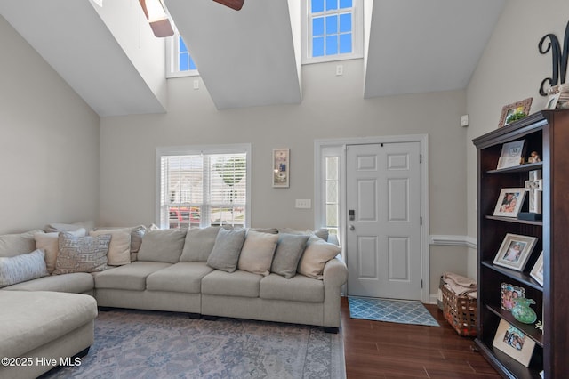 905 Sebring Dr, Winterville, NC 28590 - living area with dark wood finished floors, a ceiling fan, a skylight, and high vaulted ceiling