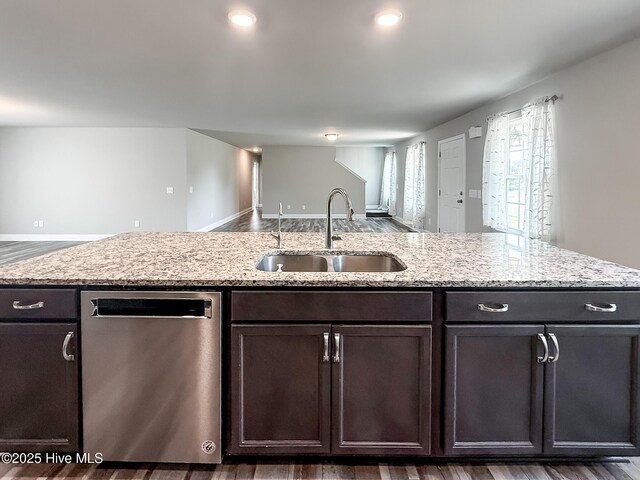126 Vick Ave, Carthage, NC 28327 - kitchen with dishwasher, a sink, dark brown cabinetry, open floor plan, and light stone countertops