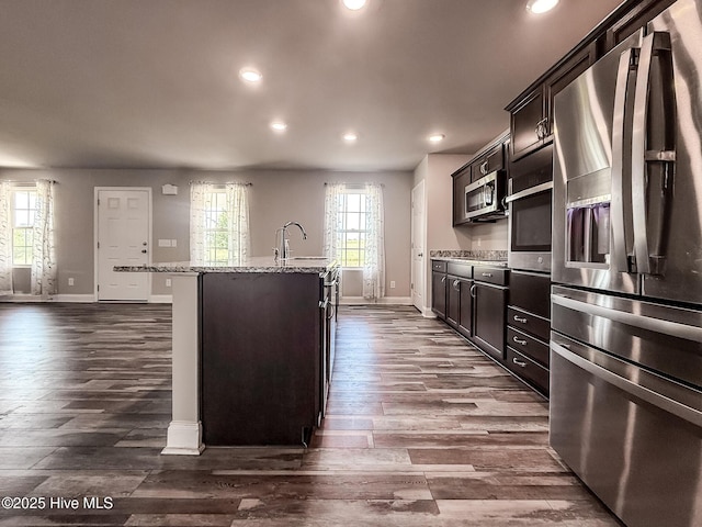 126 Vick Ave, Carthage, NC 28327 - kitchen with appliances with stainless steel finishes, baseboards, recessed lighting, a center island with sink, and dark wood-style floors