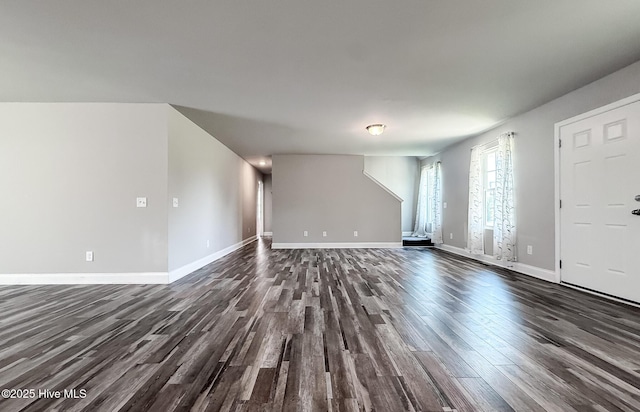 126 Vick Ave, Carthage, NC 28327 - unfurnished living room with dark wood-type flooring and baseboards