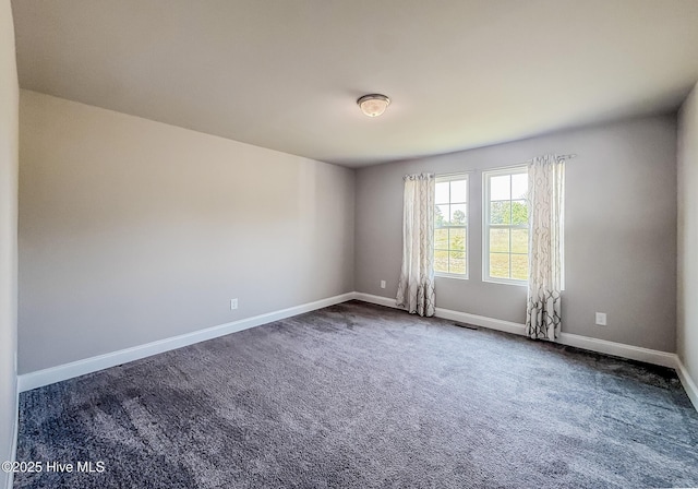 126 Vick Ave, Carthage, NC 28327 - unfurnished room featuring baseboards and dark carpet