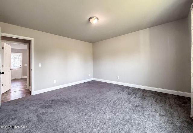 126 Vick Ave, Carthage, NC 28327 - unfurnished room with dark carpet and baseboards