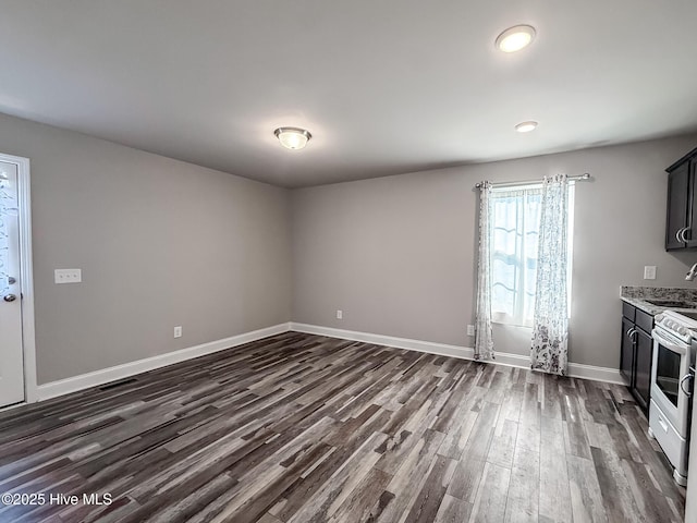 126 Vick Ave, Carthage, NC 28327 - kitchen with a sink, dark wood-style flooring, electric stove, and baseboards